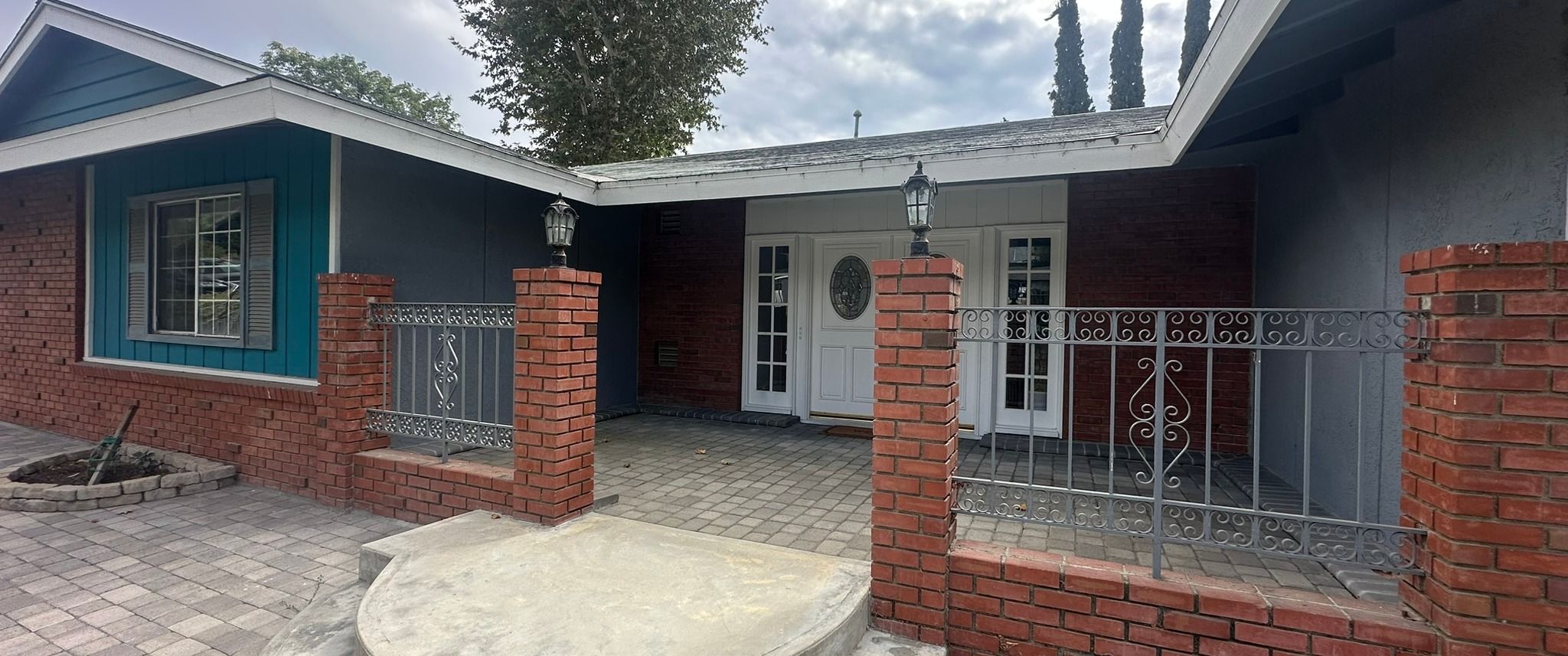 An Akopi custom-home project — front entry with brick piers and new hardscape, as built
