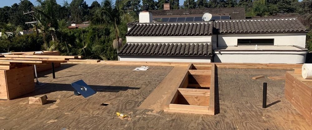 Santa Monica remodel — roof framing with skylight openings above the primary bath, under construction